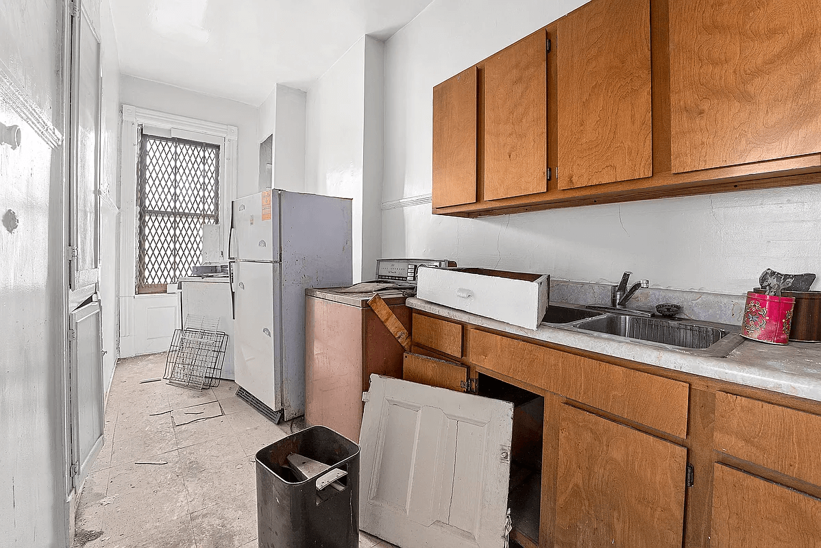 kitchen with damaged tile floor