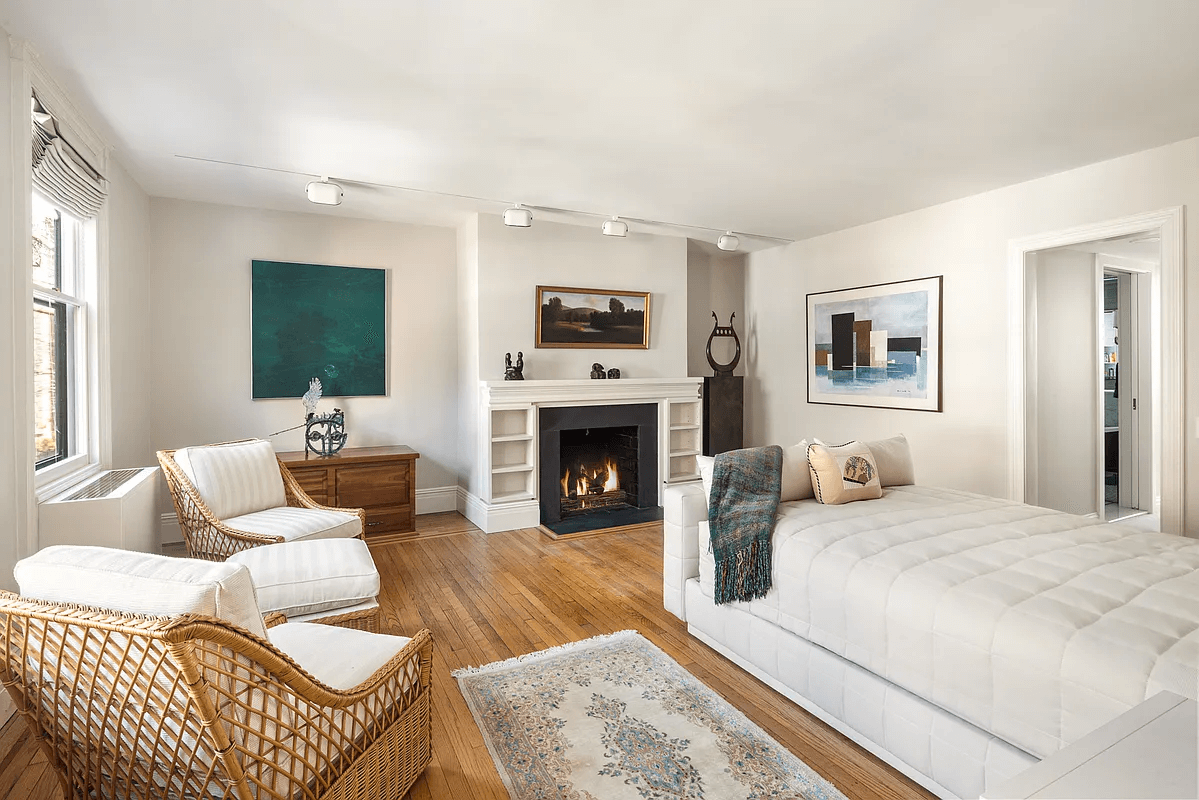 bedroom with wood burning fireplace