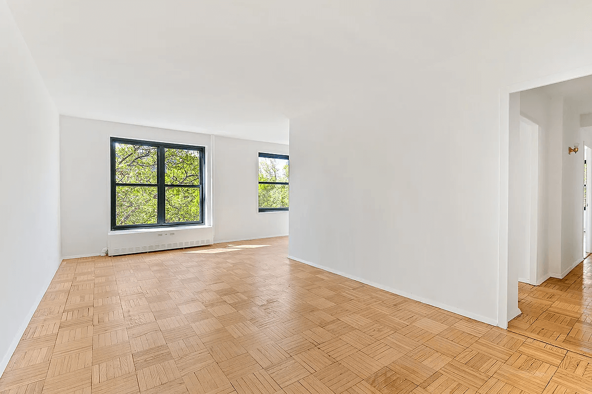 clinton hill cooperative -living room with parquet floor and two windows