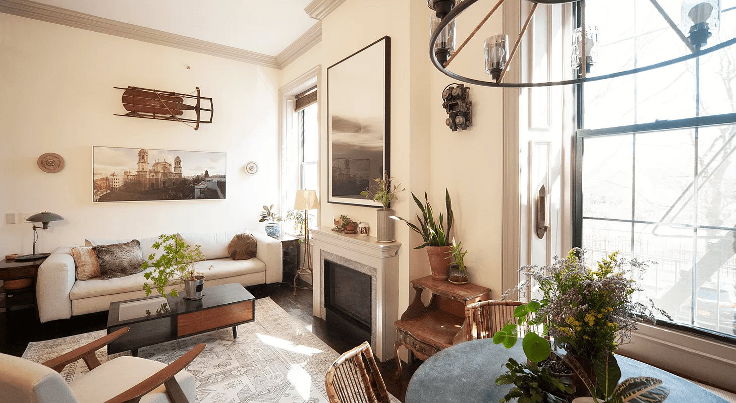 living room with mantel and dining area