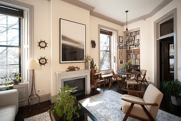 living room with mantel and dining area