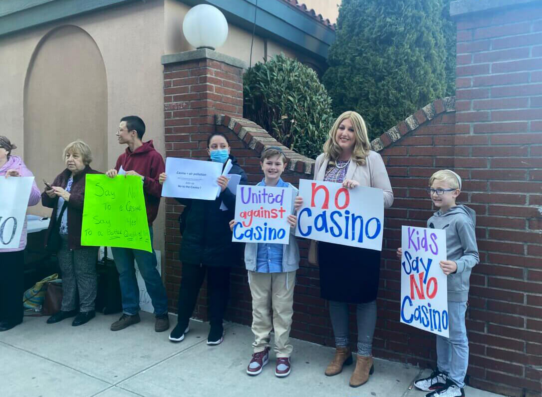 coney island casino - people with signs