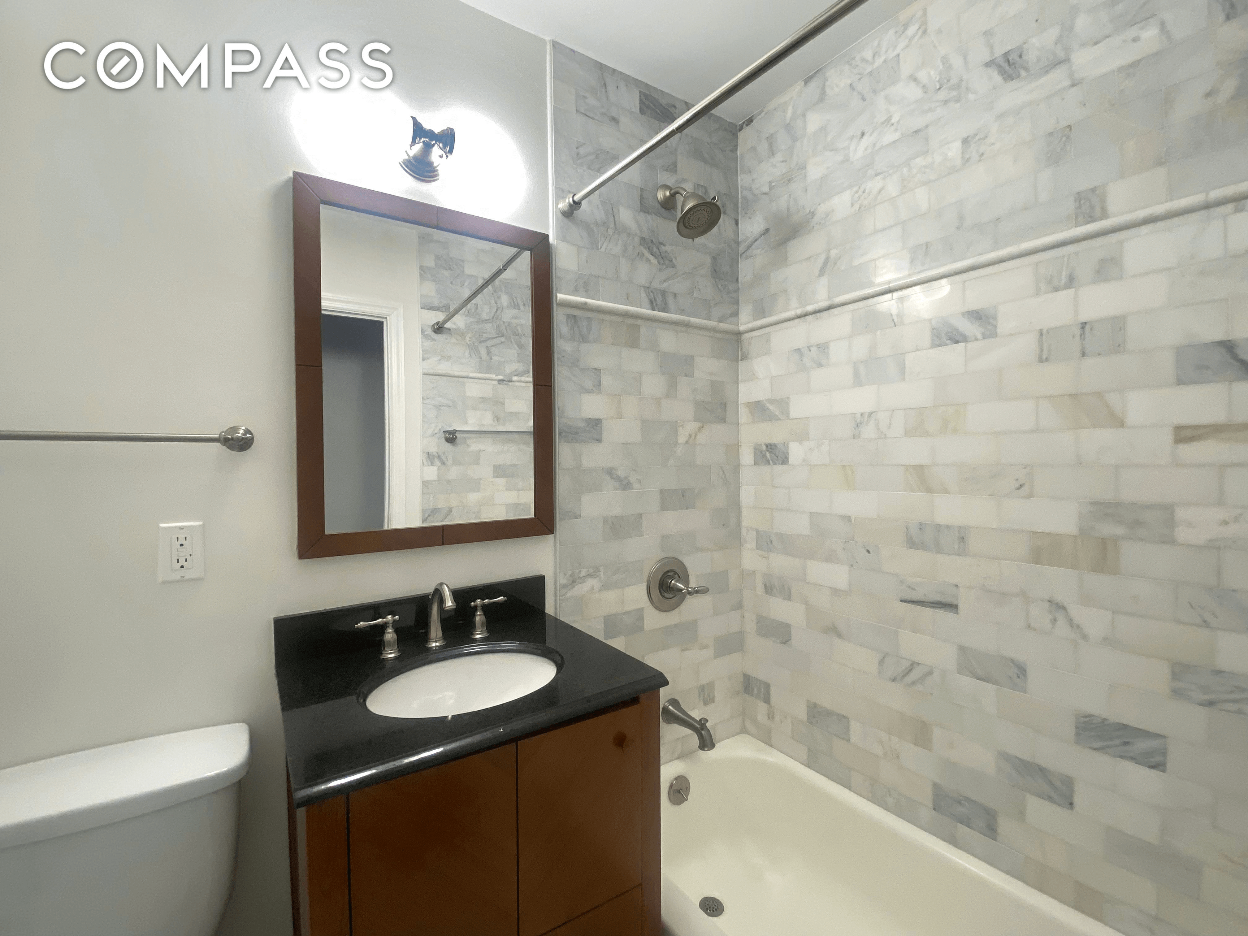 bathroom with gray tile