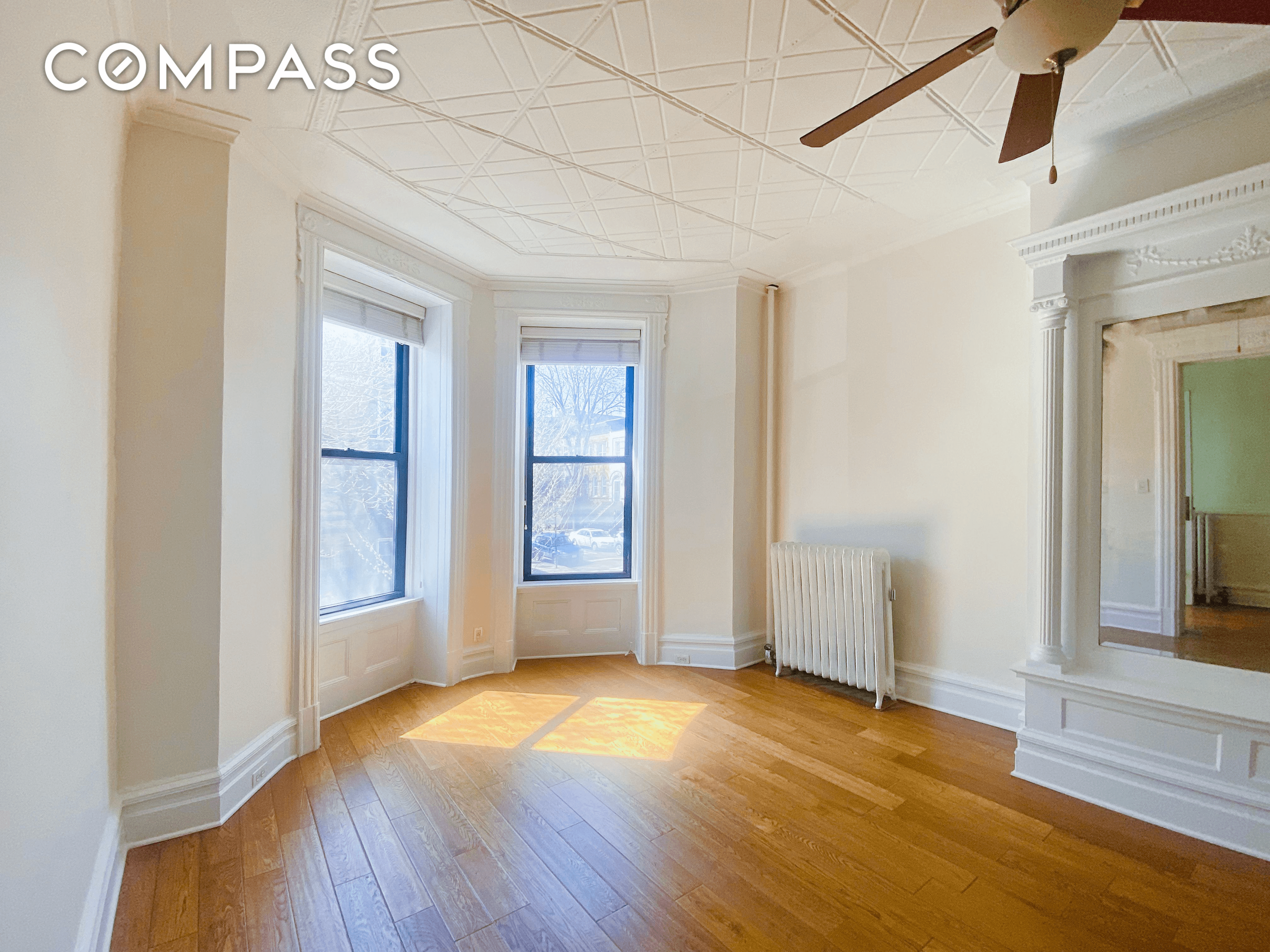 living room with pier mirror