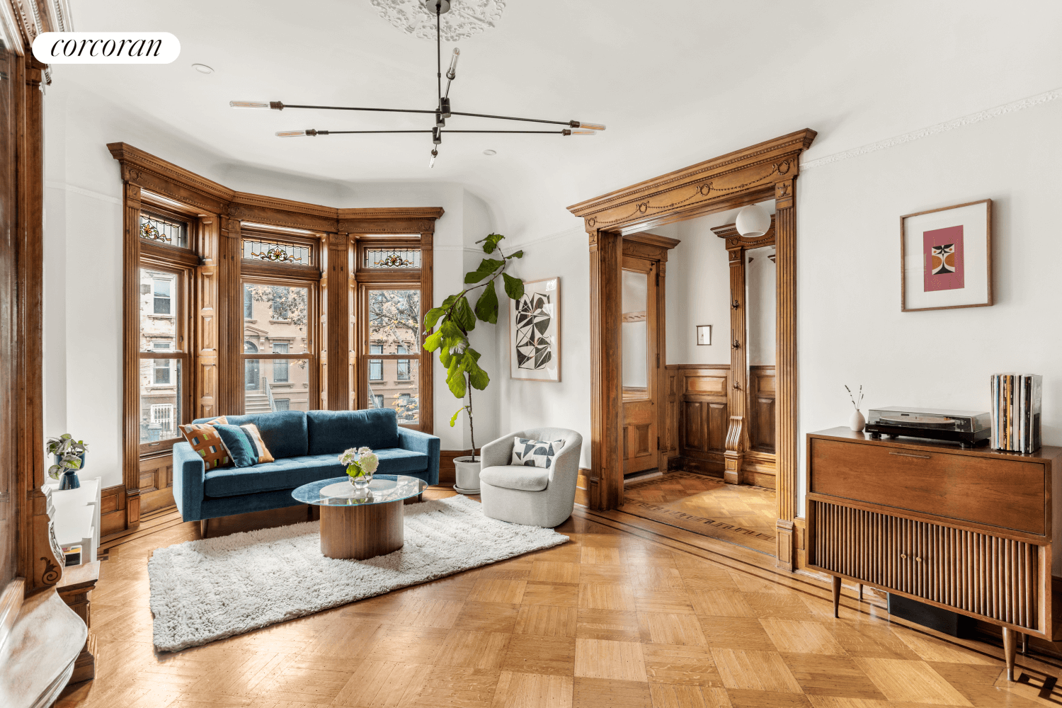 parlor with pier mirror and stained glass windows