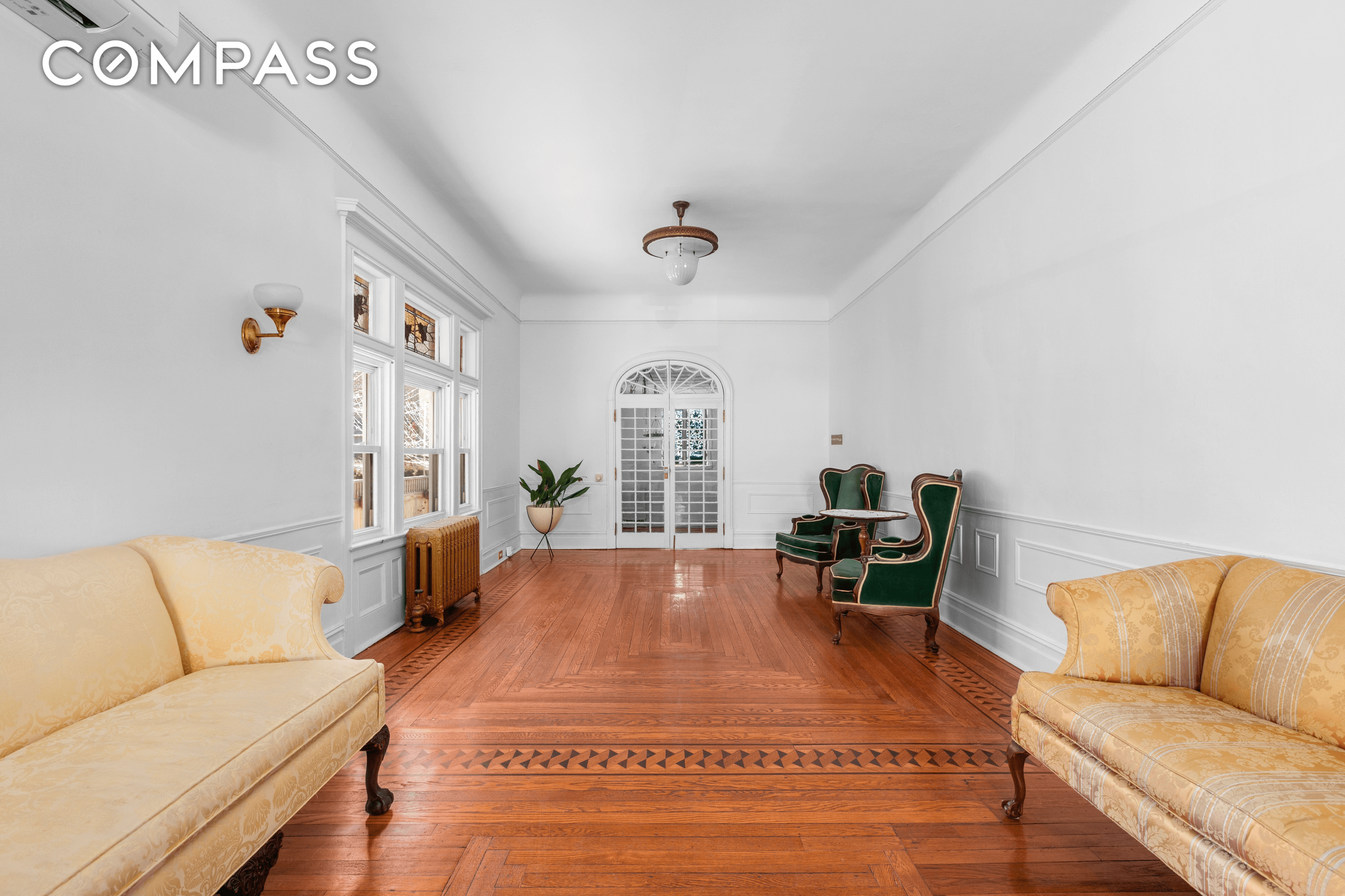 great room with wood floor with inlaid border