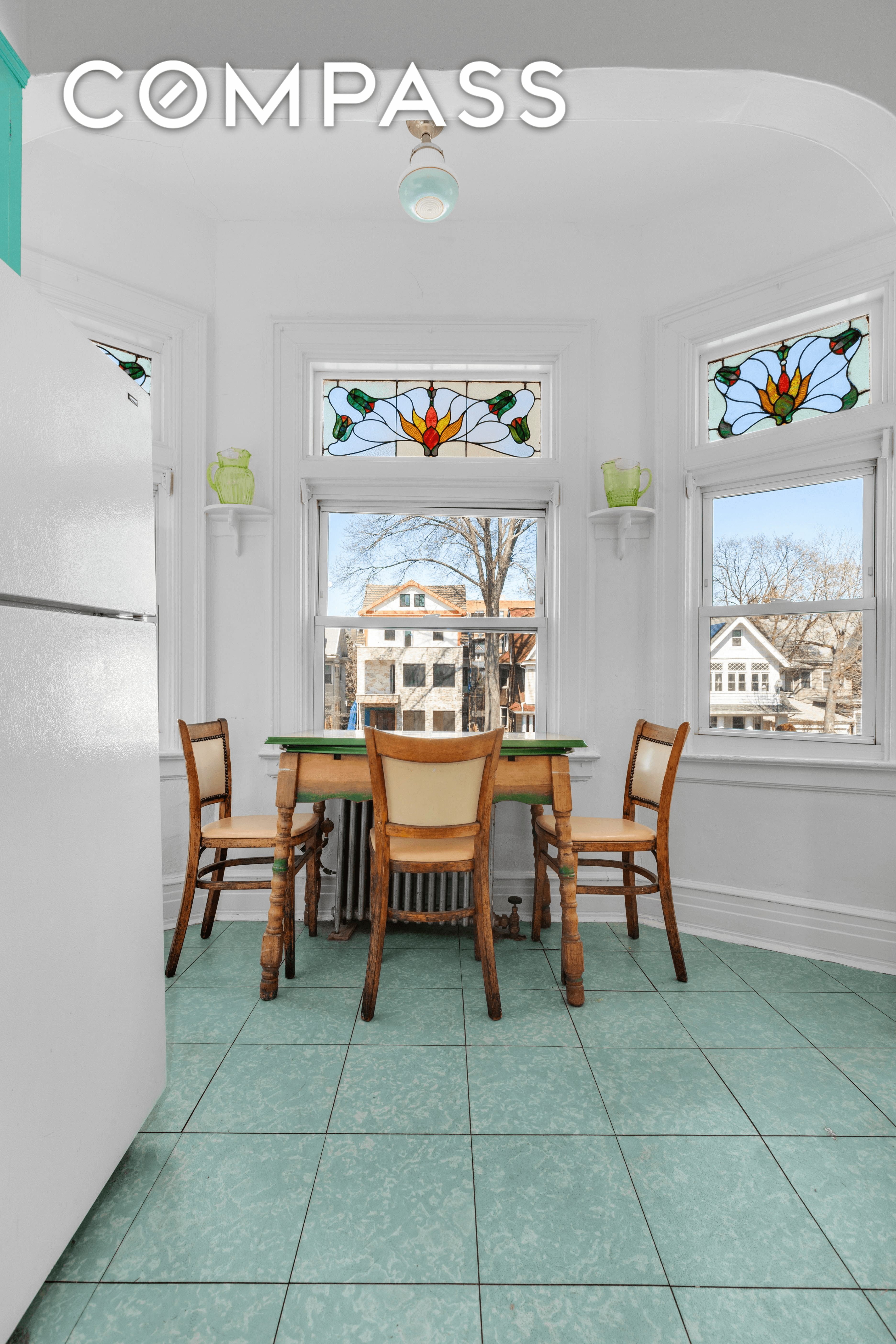 kitchen with tile floor and stained glass windows