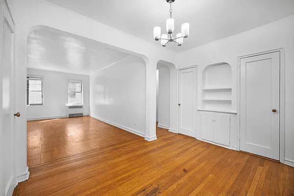 foyer with niche and view into living room
