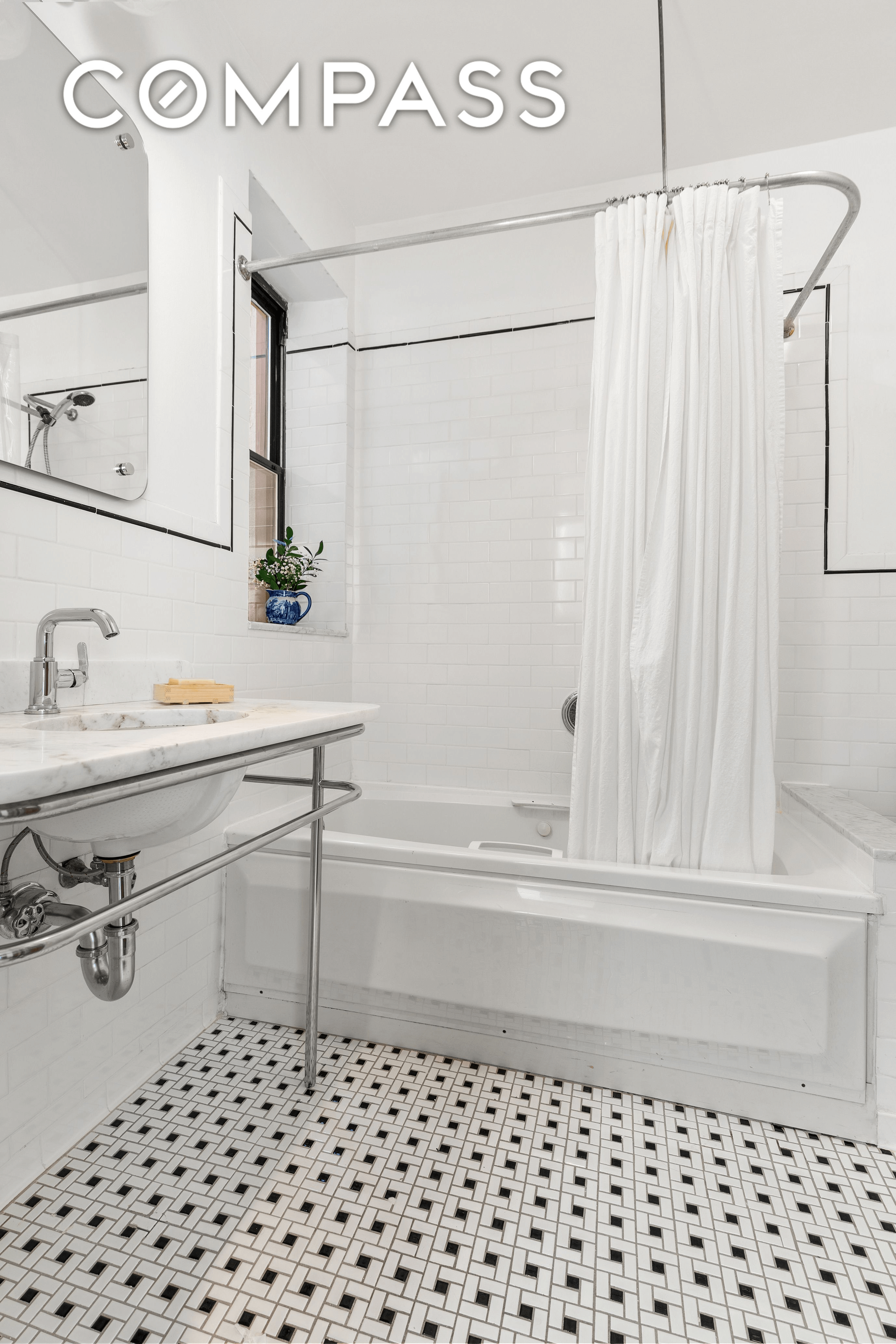 bathroom with marble sink and basketweave floor