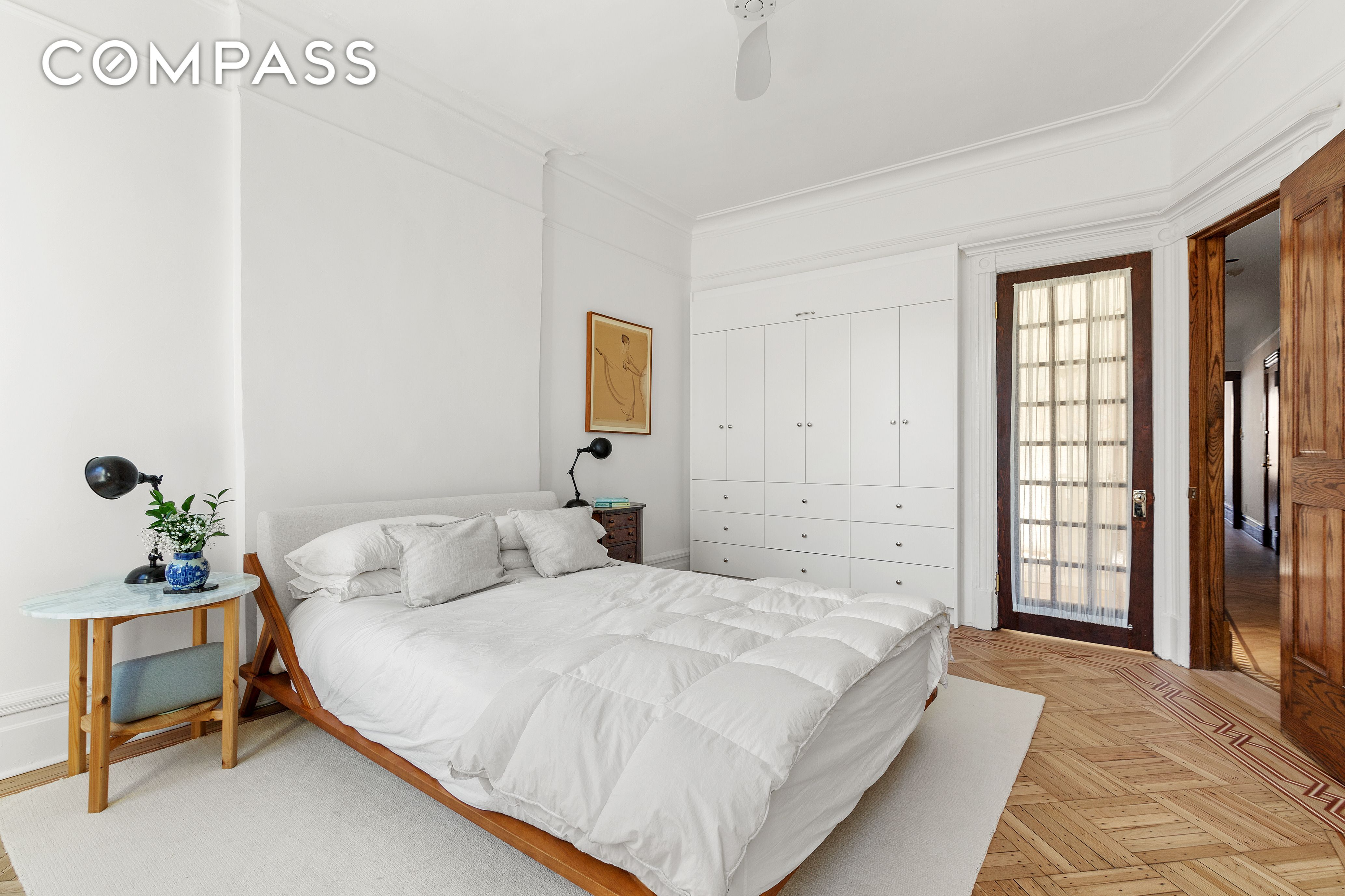 bedroom with picture rail and wood floor