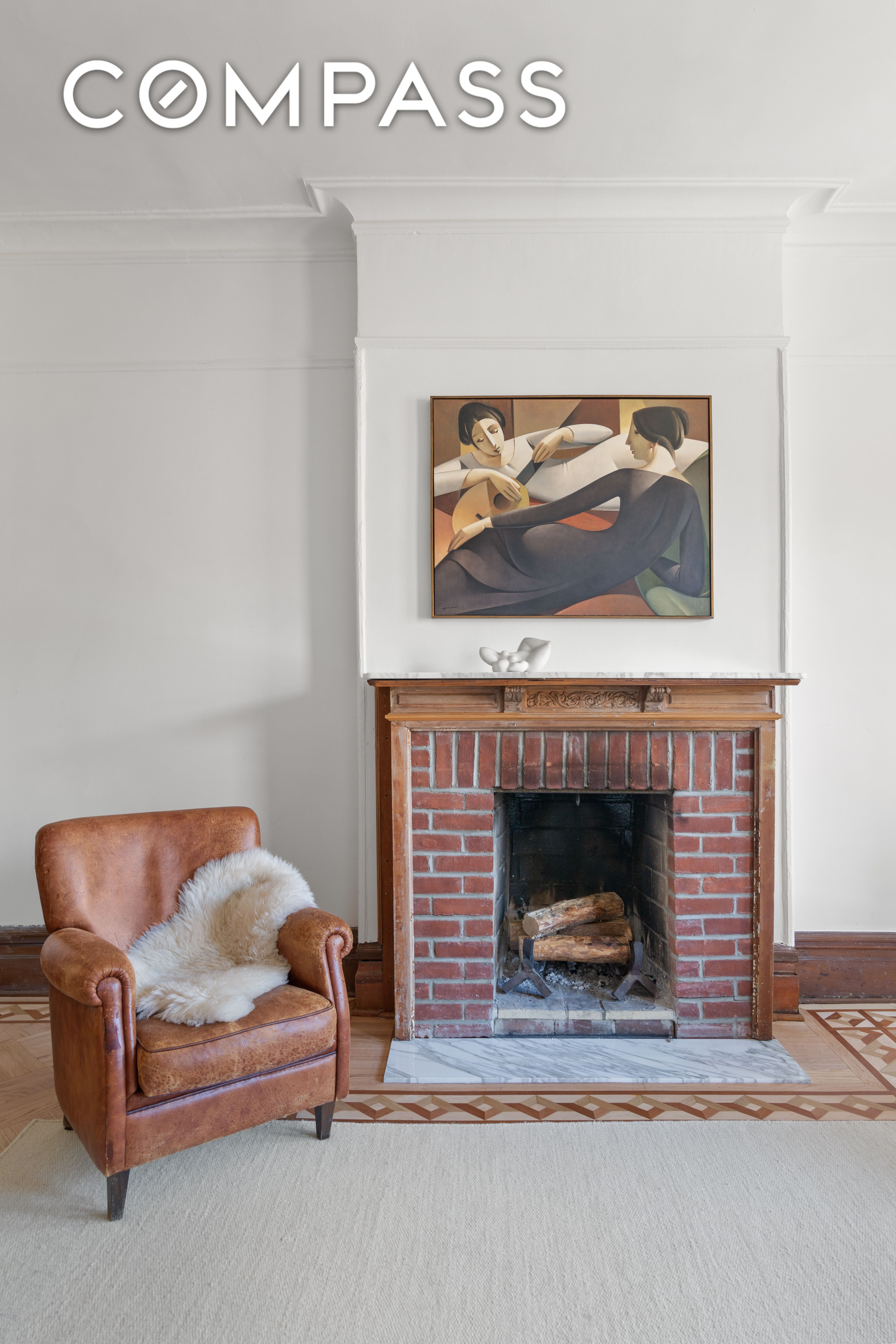 mantel in living room with marble hearth