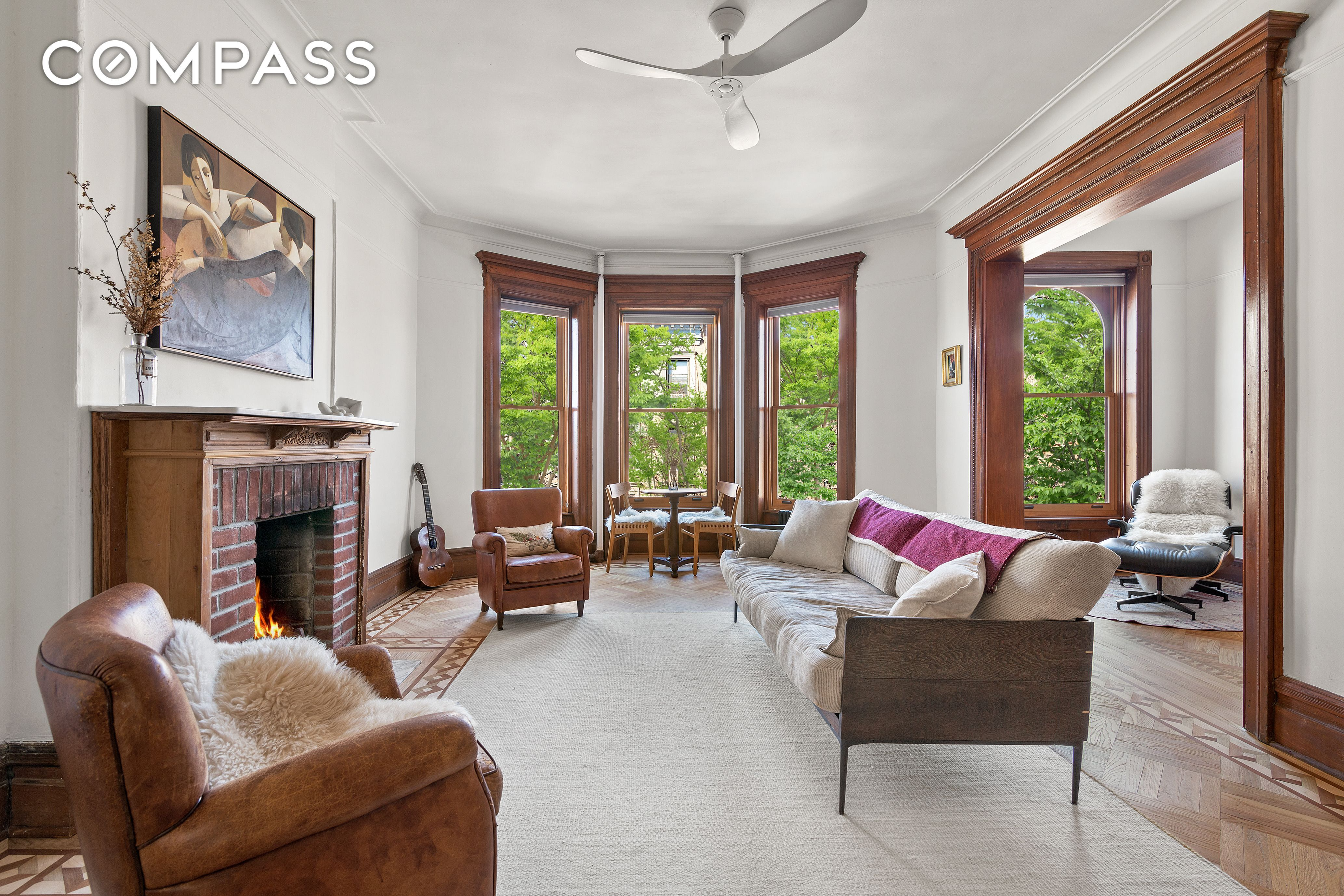 living room with mantel and wood floors