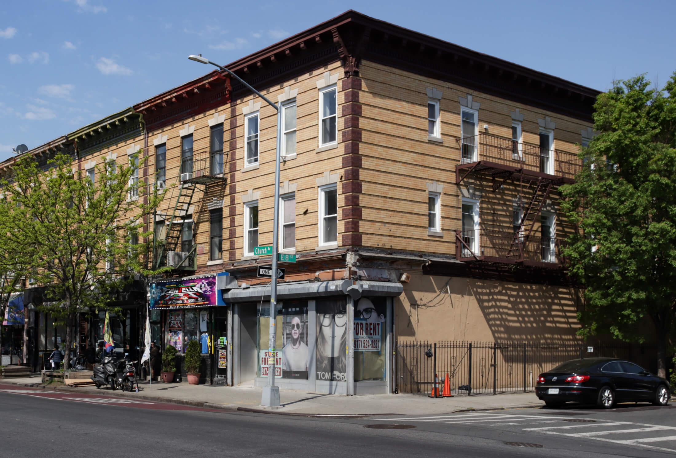 brick building at the corner of church and east 8th