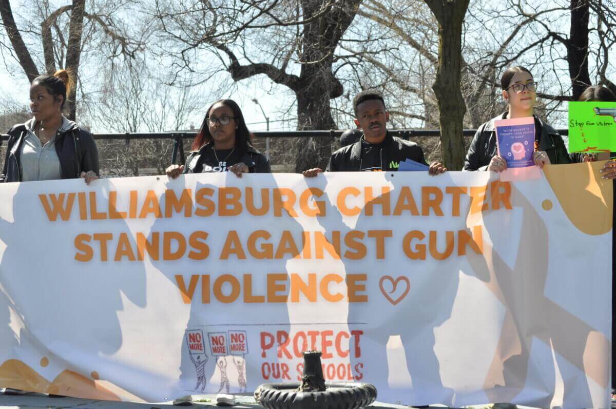 students holding a banner