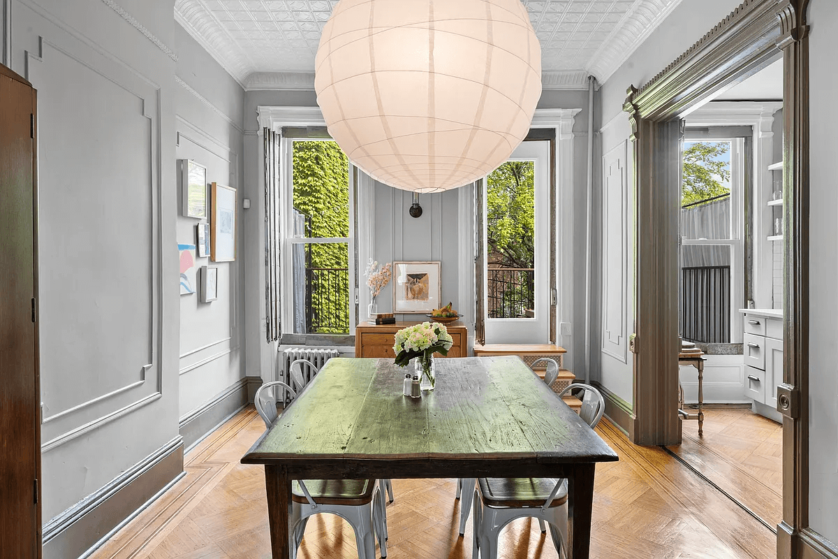 dining room with wood floors and gray walls