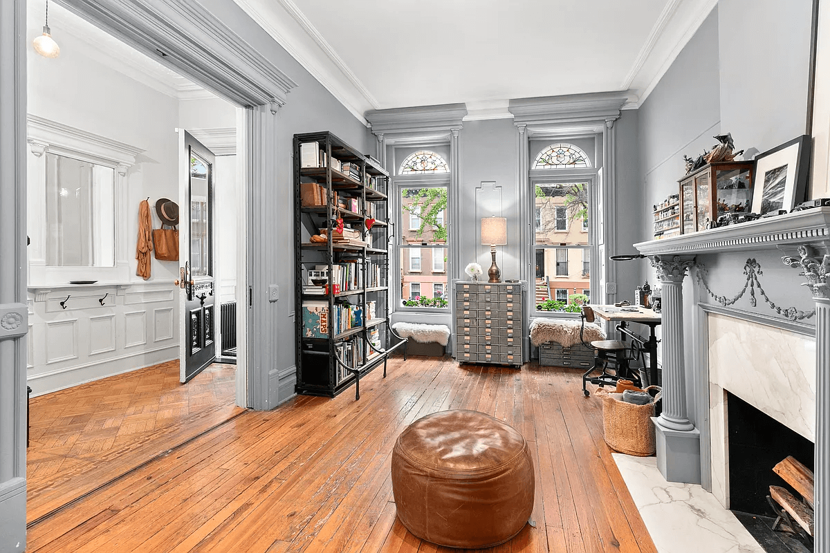 santigold brownstone - parlor with mantel and stained glass windows