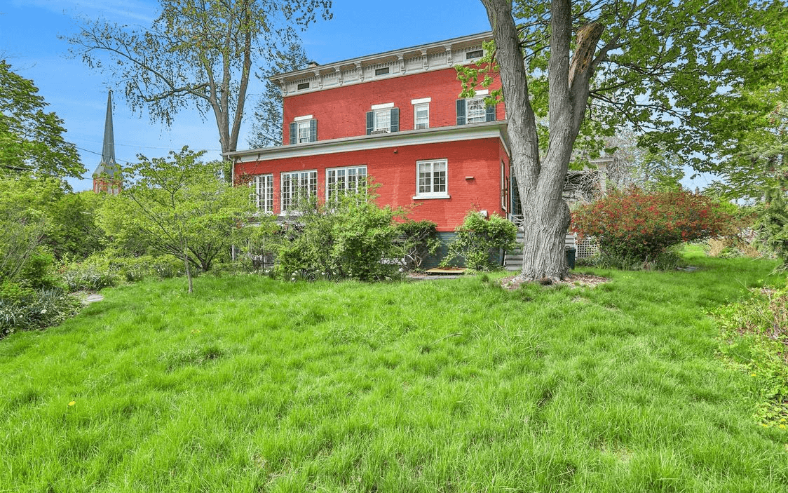 rear facade of the red brick house