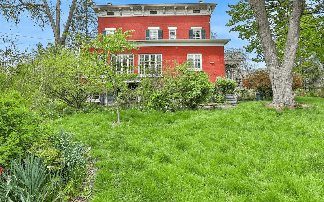 rear facade of the red brick house