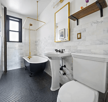 bathroom with black tile floor