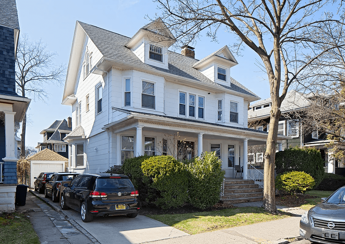 exterior of the house with porch and dormers