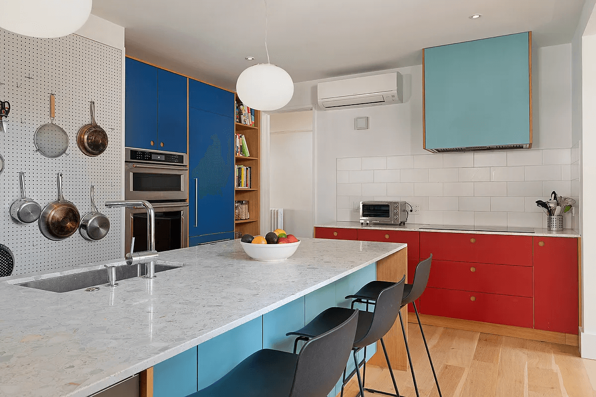 kitchen with island and cabinets in red and blue