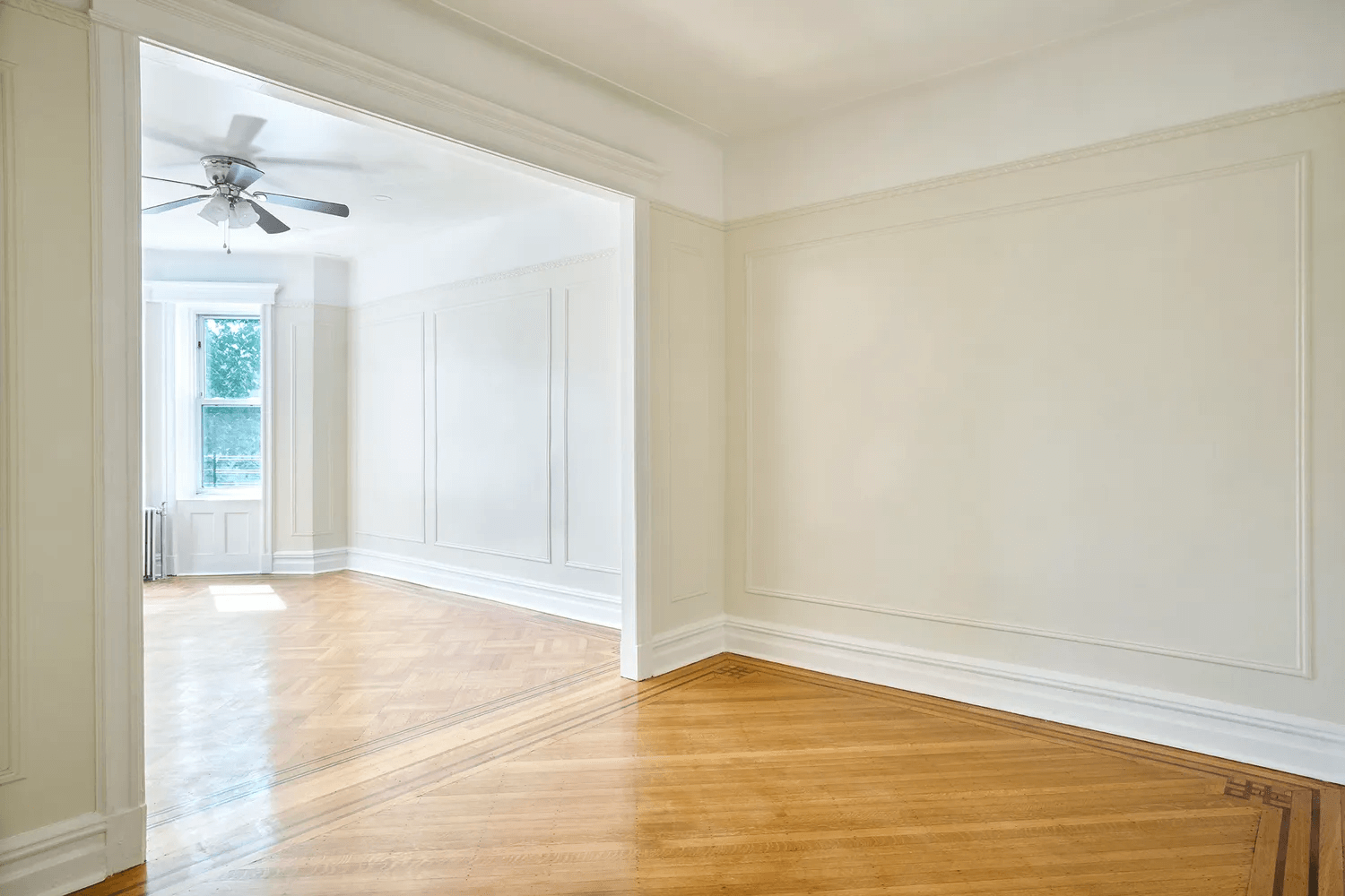 middle room with picture rails and wall moldings