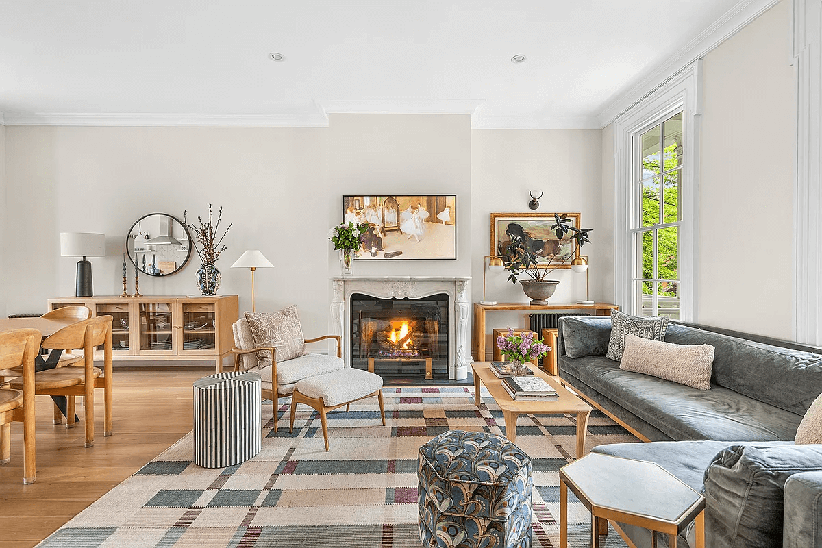 parlor with ear moldings and a later mantel