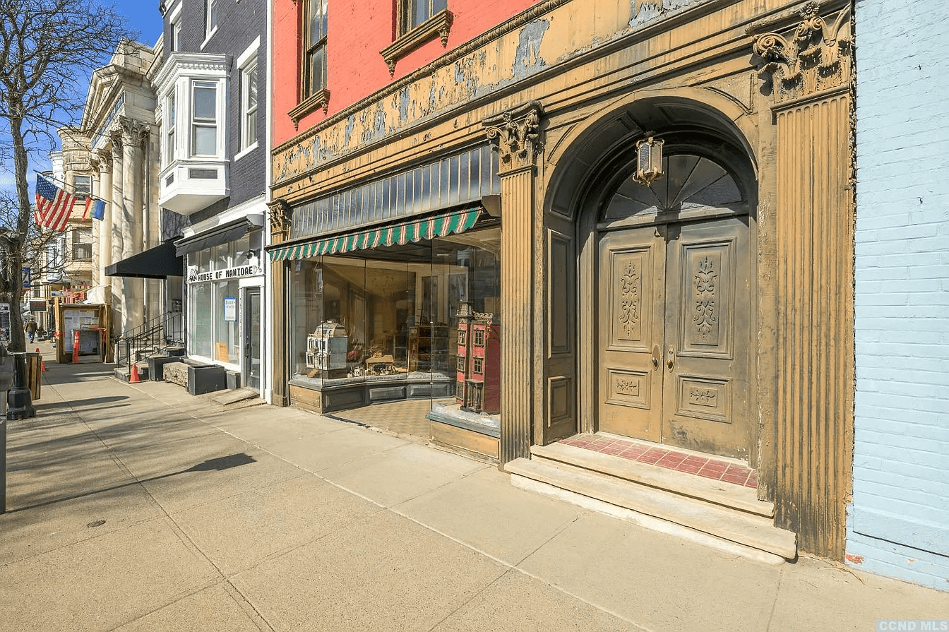 view of arched entry door with pilasters