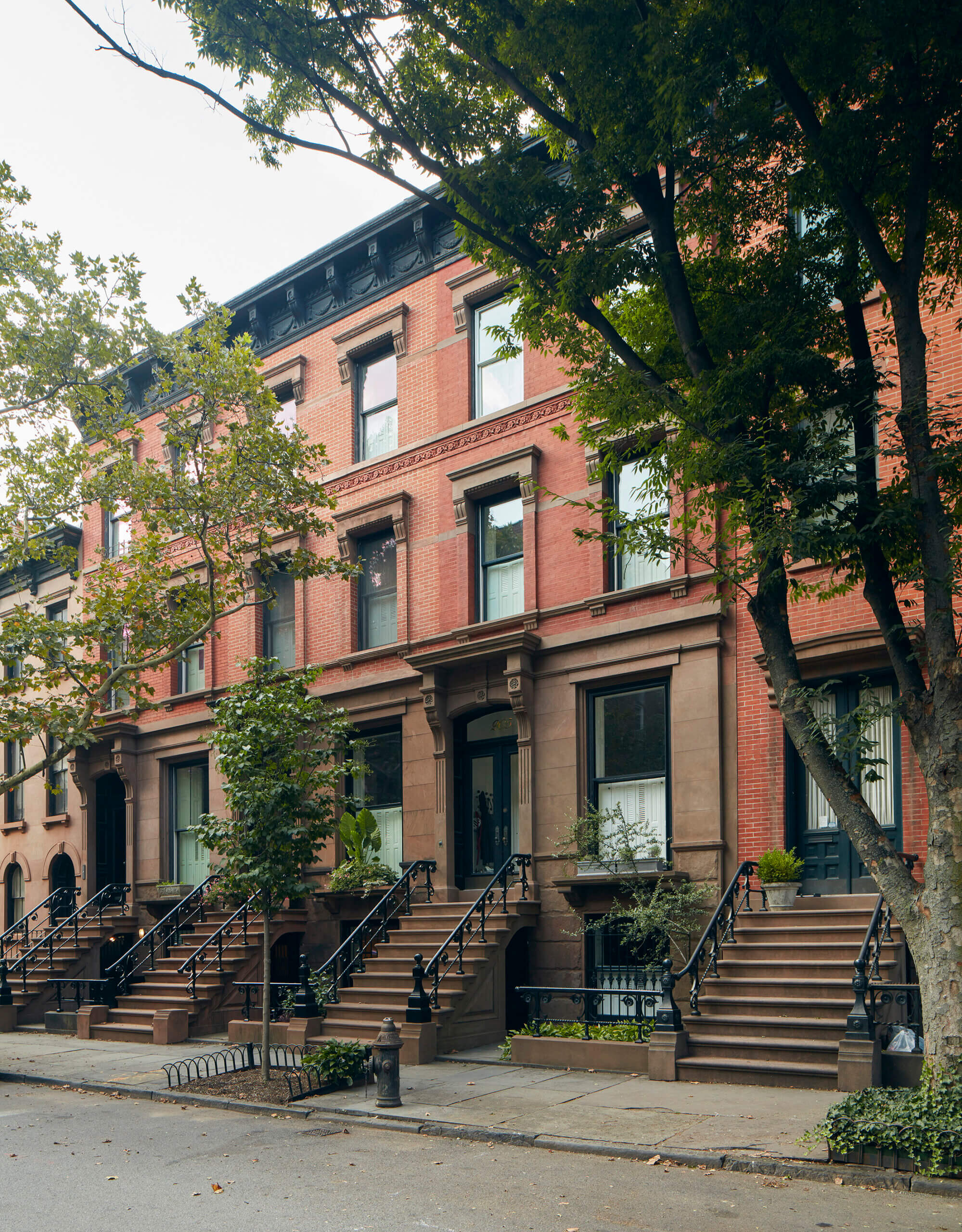 EXTERIOR of the brick and brownstone row house