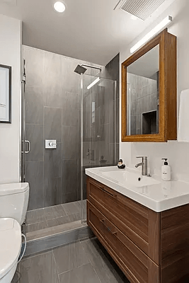 bathroom with wood vanity