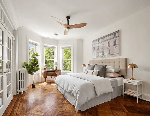 bedroom with bay window and wood floor