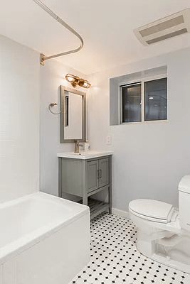 bathroom with black and white tile on garden level