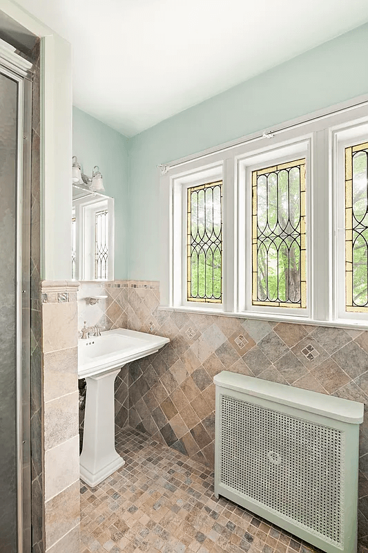 bathroom with brown tile