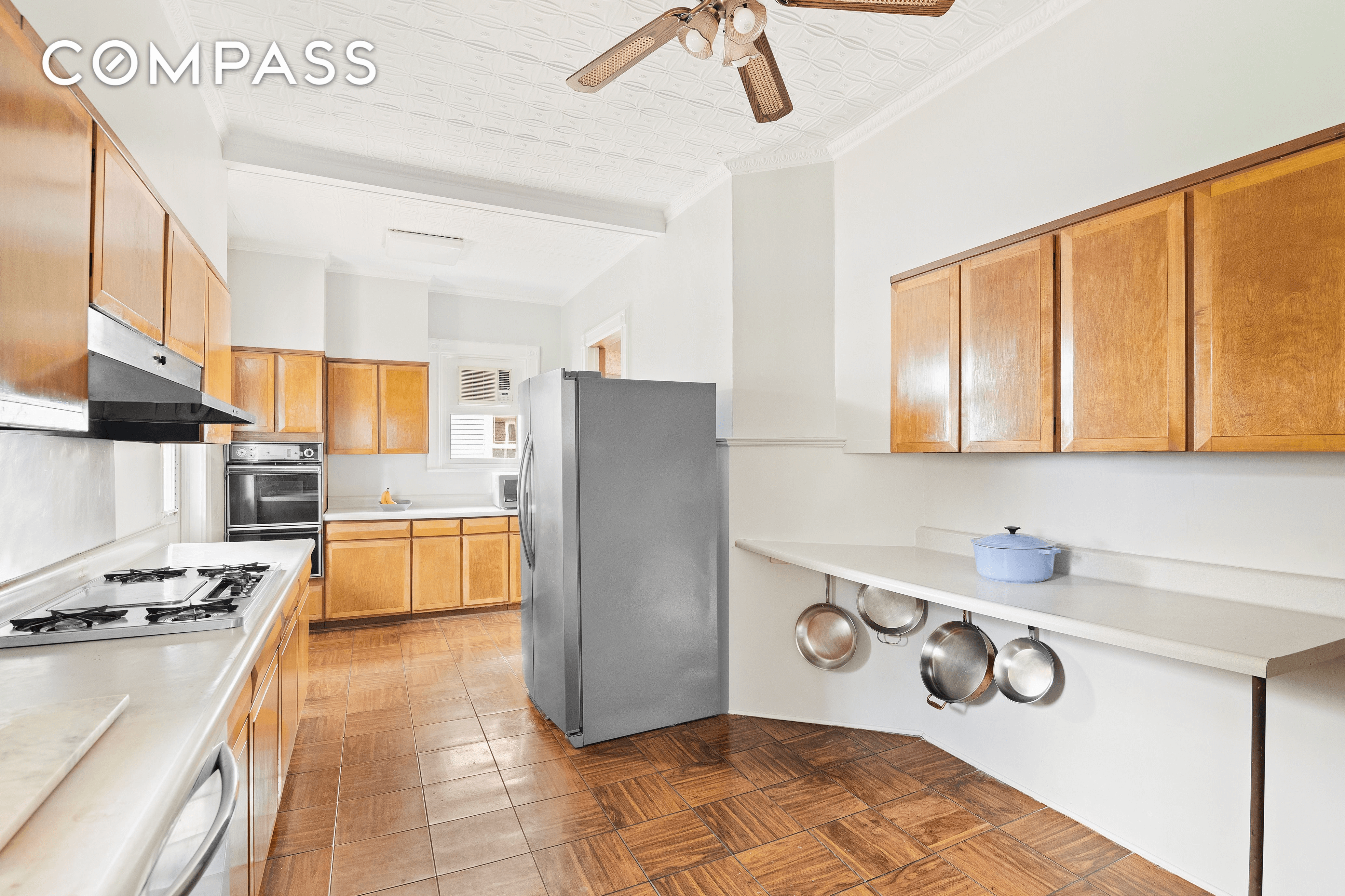 kitchen with wood floor and cabinets