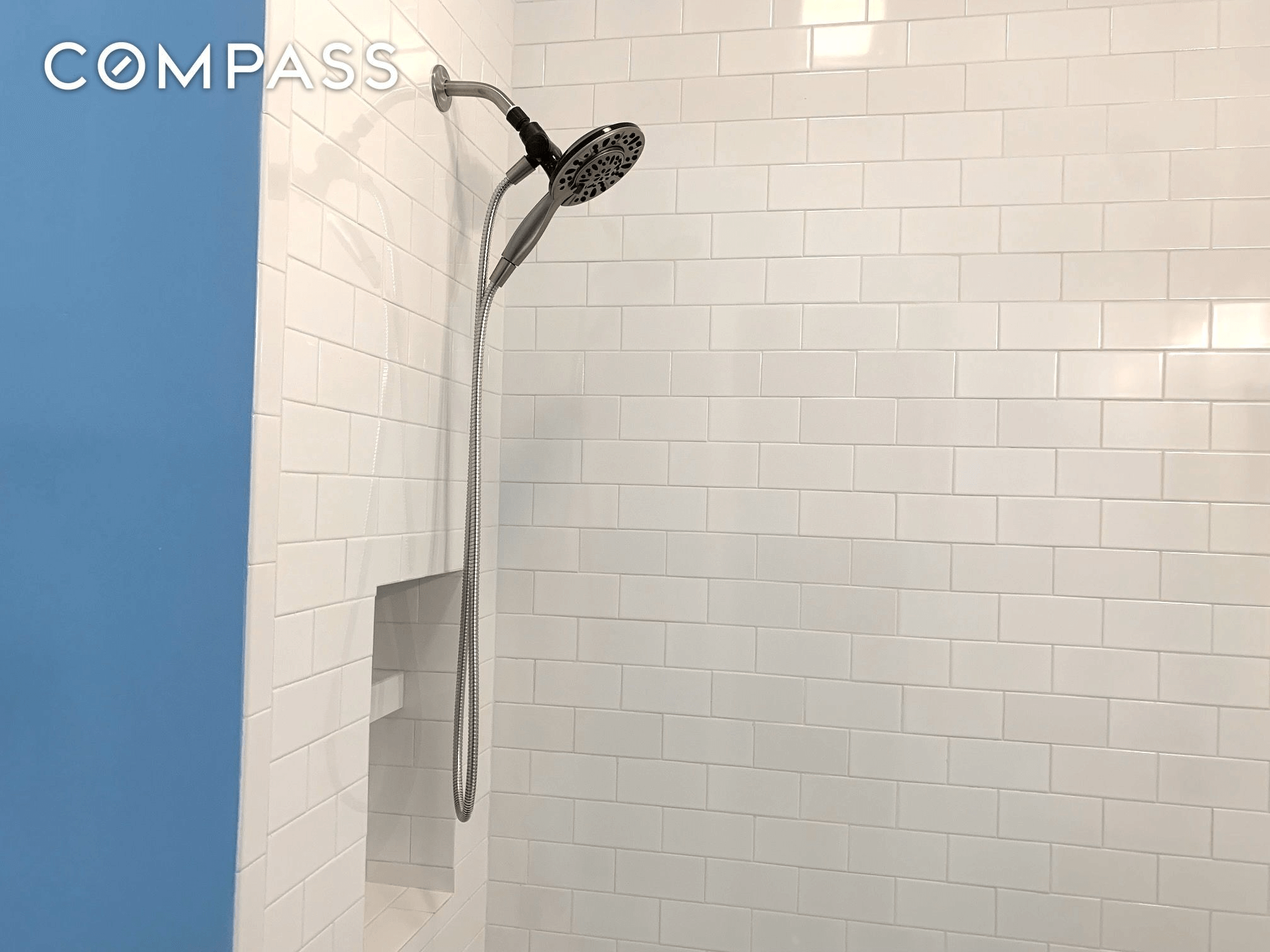 bathroom with white subway tile in shower