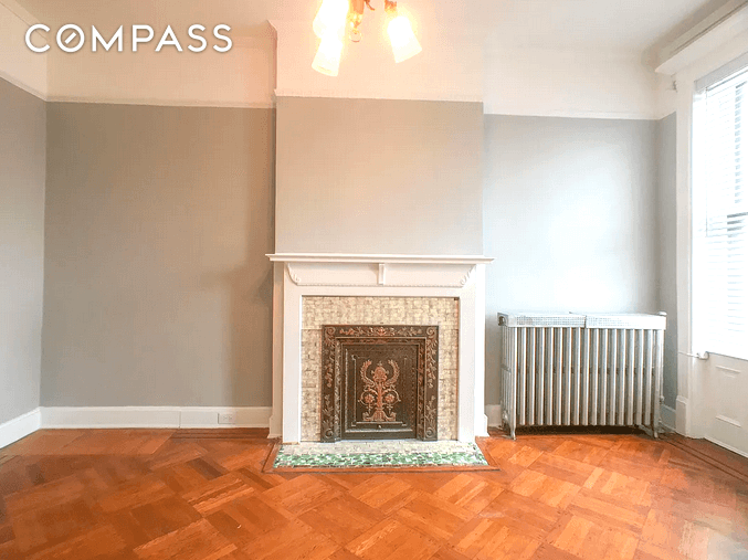 bedroom with mantel and picture rail