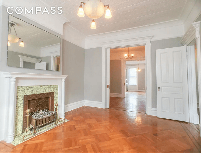 living room with mantel and wood floors