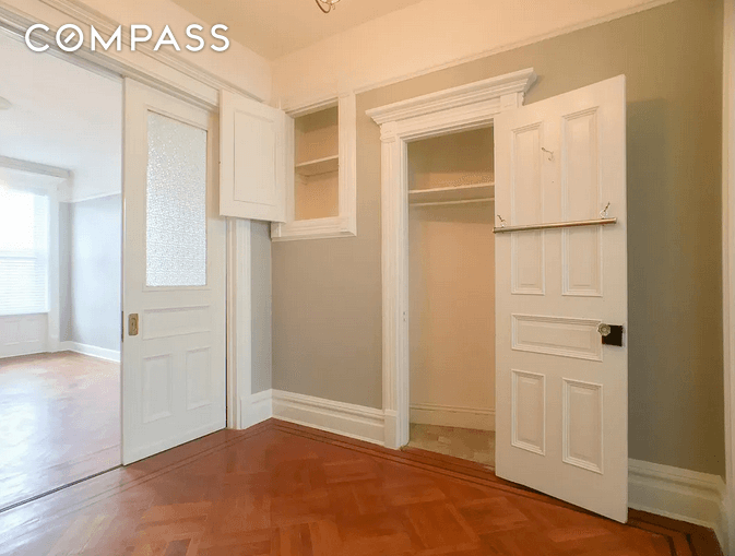 middle room with closet and pocket doors
