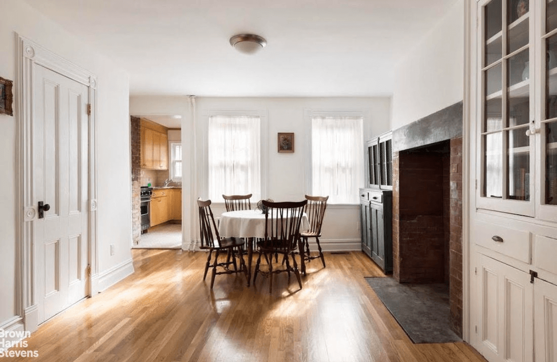 dining area in garden apartment with fireplace