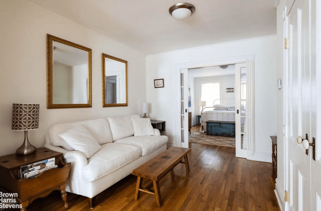 garden apartment living room with pocket doors to bedroom