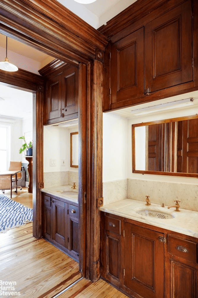 passthrough with marble sinks and original built-ins