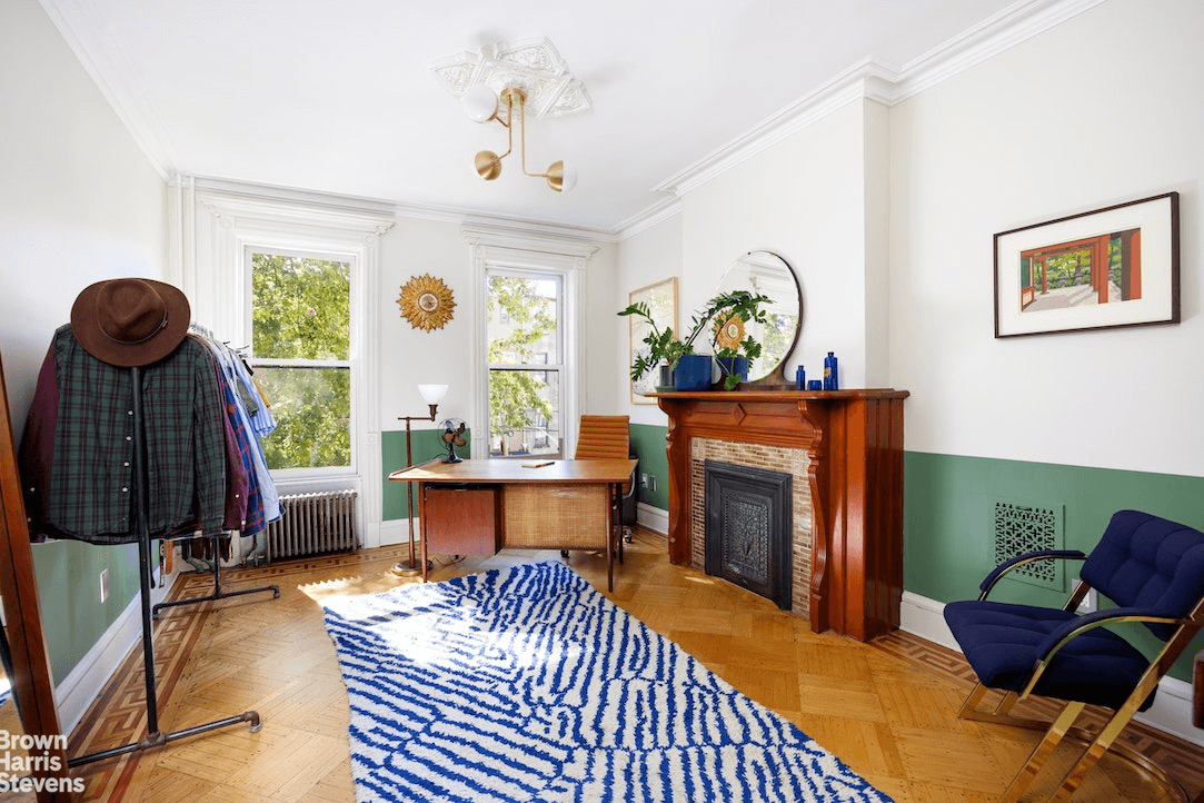 bedroom with a mantel set up as an office