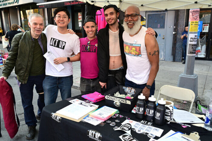 volunteers in front of an information table