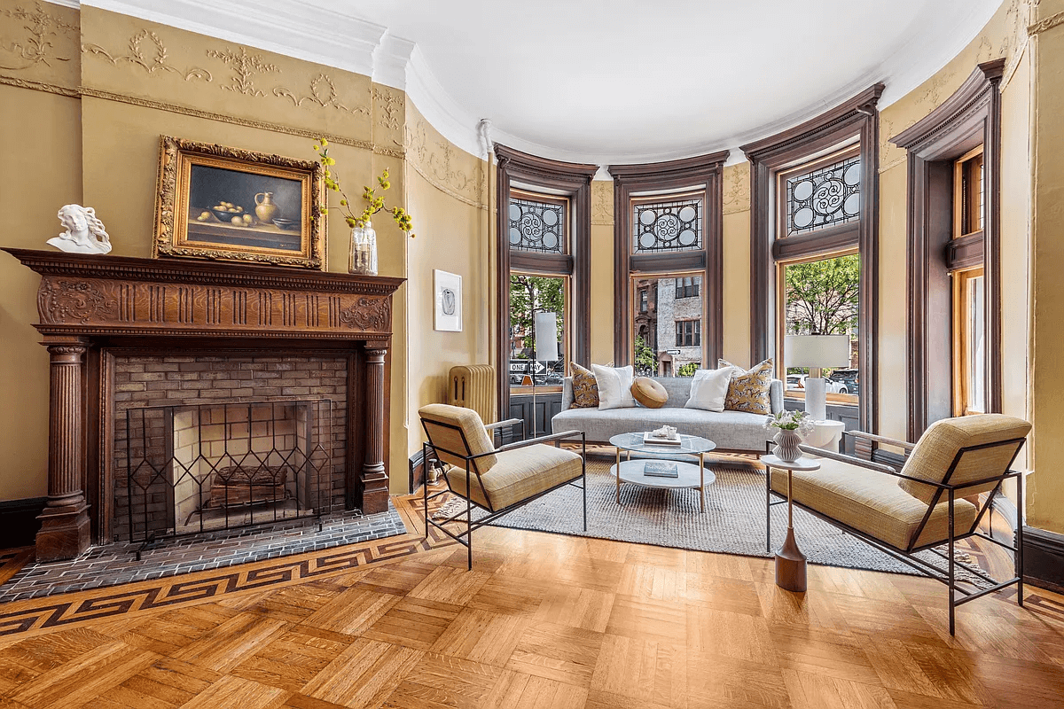 parlor with mantel and wood floors