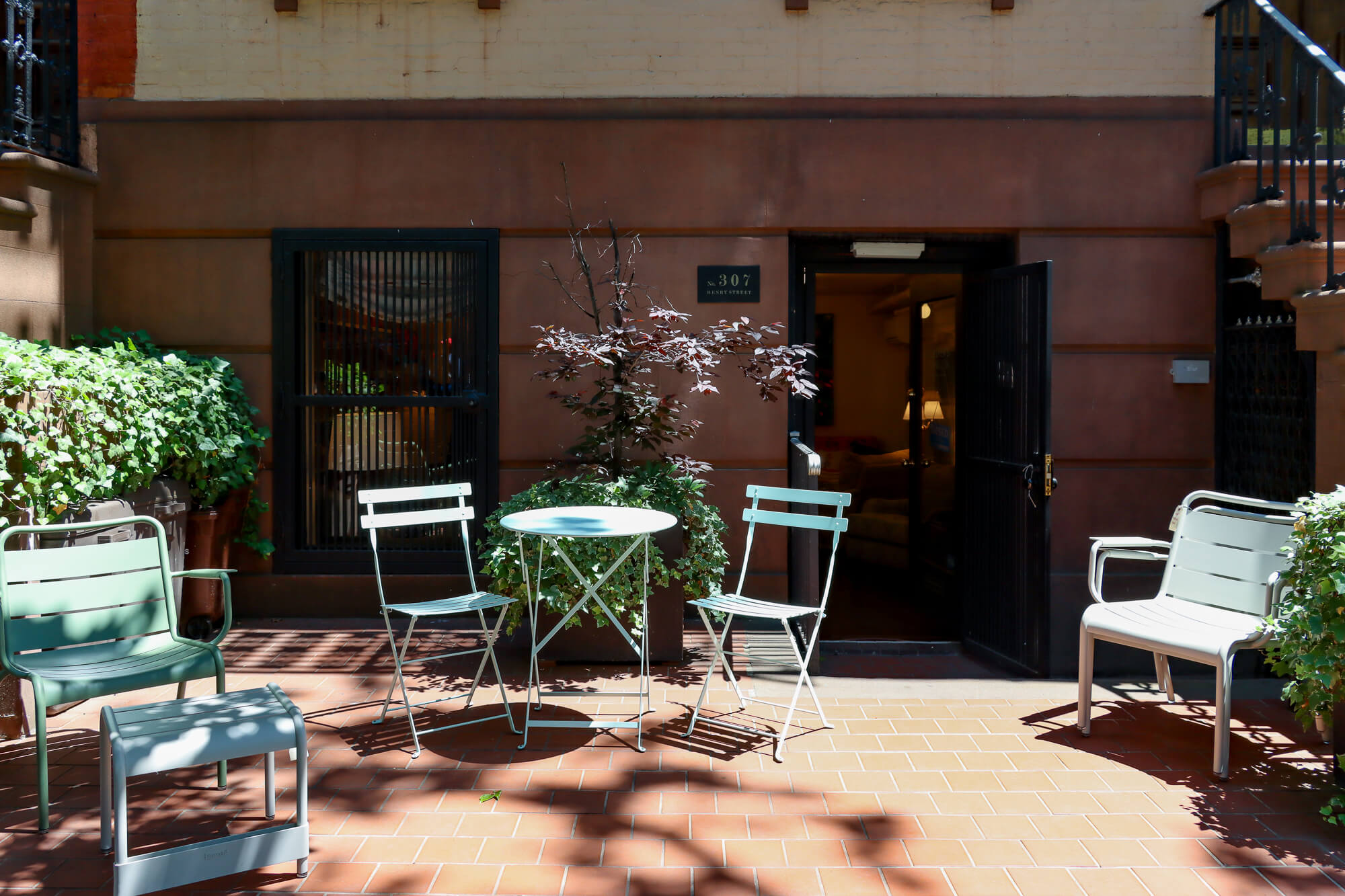 the outside of the garden level shop with lawn furniture