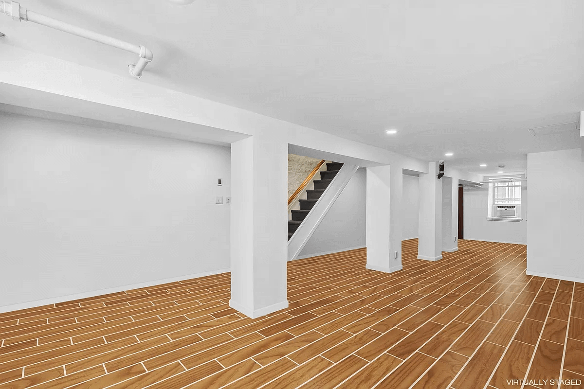 virtually staged basement with tile floor and recessed lighting