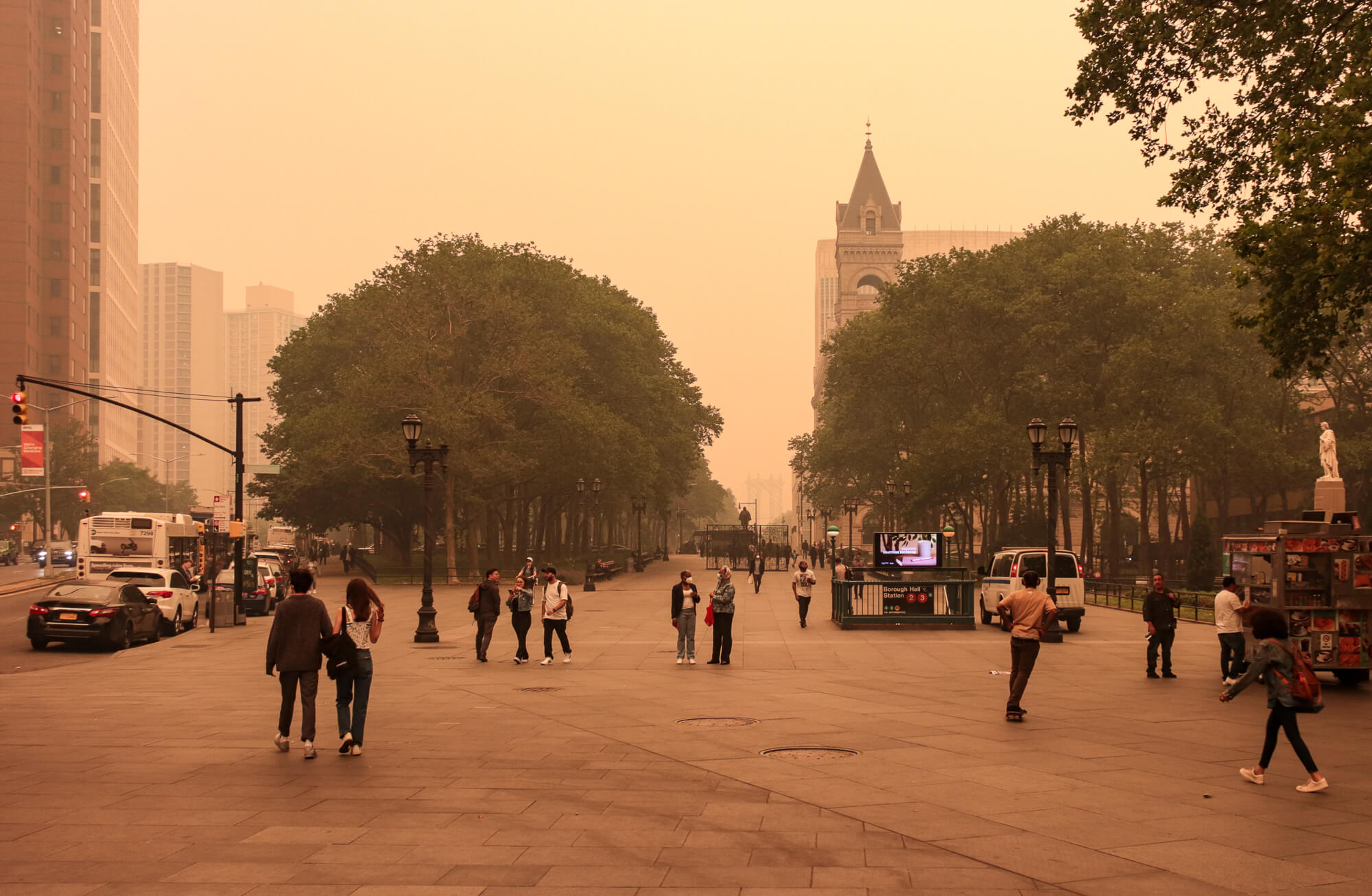 people in downtown brooklyn walking through a yellow haze - air quality