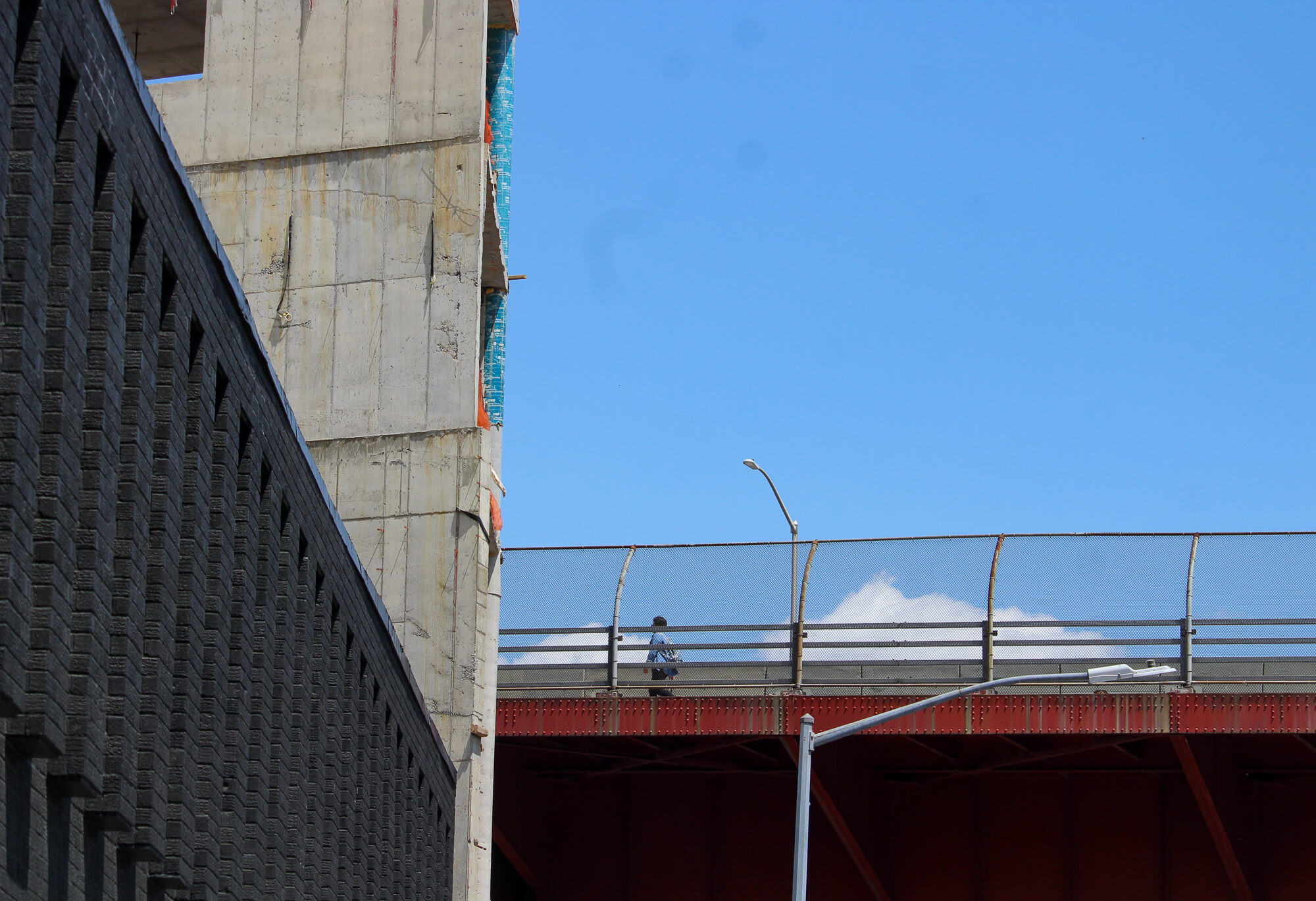 person walking on pulaski bridge