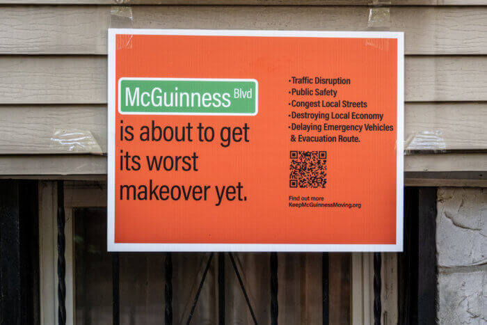 a sign reading mcguinness blvd is about to get its worst makeover yet