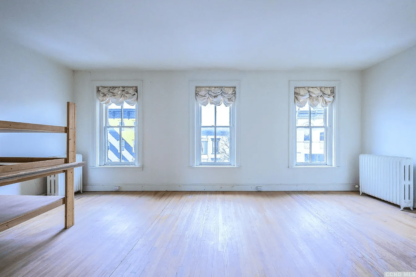 bedroom with three windows